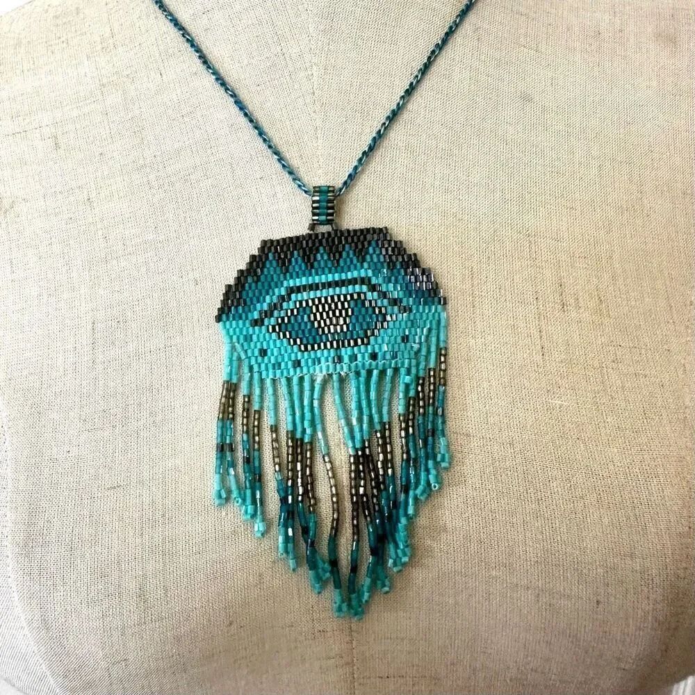 Long blue beaded pendant necklace
